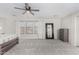 Spacious primary bedroom featuring a ceiling fan, carpeting, three windows and neutral decor at 25589 W Pleasant Ln, Buckeye, AZ 85326