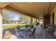 Inviting back patio perfect for outdoor dining, gatherings, or simply enjoying the serene backyard views at 25742 N 103Rd Dr, Peoria, AZ 85383