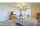 Bright and airy bedroom offers a relaxing space with natural light and neutral tones to create a soothing atmosphere at 25742 N 103Rd Dr, Peoria, AZ 85383