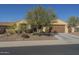 Inviting single-story home featuring desert landscaping and a two-car garage at 25742 N 103Rd Dr, Peoria, AZ 85383