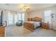 Spacious main bedroom featuring ample natural light, a ceiling fan, and room for furniture arrangements at 25742 N 103Rd Dr, Peoria, AZ 85383