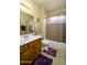 Bathroom with a vanity and shower with tub, neutral paint, and tile flooring at 2662 S Springwood S Blvd # 338, Mesa, AZ 85209