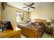 Bedroom with a ceiling fan and large window for optimal natural lighting at 2662 S Springwood S Blvd # 338, Mesa, AZ 85209