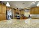 Open kitchen featuring granite counters, stainless steel appliances, and a breakfast bar with views of the rest of the home at 2662 S Springwood S Blvd # 338, Mesa, AZ 85209