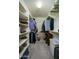 Walk-in closet with shelving and hanging racks for optimal storage at 2662 S Springwood S Blvd # 338, Mesa, AZ 85209