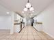 Open kitchen with stainless appliances and modern lighting at 2737 W Alice Ave, Phoenix, AZ 85051