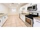 Modern kitchen featuring stainless appliances and granite countertops at 2737 W Alice Ave, Phoenix, AZ 85051