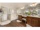 Well-appointed bathroom with a glass-enclosed shower, separate tub, and stylish vanity at 2744 E Donato Dr, Gilbert, AZ 85298
