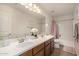 Bathroom featuring a double sink vanity, modern fixtures, and a separate bathtub and shower at 2744 E Donato Dr, Gilbert, AZ 85298