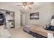 Bedroom with a ceiling fan, a comfortable bed, and a walk in closet at 2744 E Donato Dr, Gilbert, AZ 85298