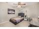 Cozy bedroom with a comfortable bed, stylish furnishings, and a large piece of wall art at 2744 E Donato Dr, Gilbert, AZ 85298