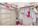 Walk-in closet with built-in drawers and hanging racks for easy clothing organization at 2744 E Donato Dr, Gilbert, AZ 85298