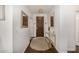Inviting entryway with decorative mirror, gold console table, and stylish light fixture at 2744 E Donato Dr, Gilbert, AZ 85298