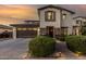 Inviting home exterior featuring manicured landscaping, stone accents, and an attached garage at 2744 E Donato Dr, Gilbert, AZ 85298