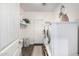 Efficient laundry room featuring side-by-side washer and dryer and ample storage at 2744 E Donato Dr, Gilbert, AZ 85298