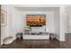 Living room area featuring an entertainment center with a large screen TV and a sleek console at 2744 E Donato Dr, Gilbert, AZ 85298