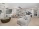 Open concept living space showcasing a sizable sectional sofa and abundant natural light at 2744 E Donato Dr, Gilbert, AZ 85298
