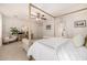Inviting bedroom featuring a canopy bed, sitting area, and calming decor at 2744 E Donato Dr, Gilbert, AZ 85298