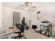 Bright office space featuring neutral walls, a ceiling fan, and a desk and chair at 2744 E Donato Dr, Gilbert, AZ 85298