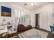 Office features a chaise lounge, desk and large shutters that filter in natural light at 2744 E Donato Dr, Gilbert, AZ 85298