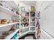 Walk-in pantry featuring shelving, pantry door and room for ample storage at 2744 E Donato Dr, Gilbert, AZ 85298