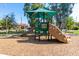 Community playground featuring shaded play structures and ample space for children to enjoy outdoor activities at 2744 E Donato Dr, Gilbert, AZ 85298