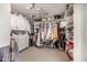 Organized walk-in closet with custom built-ins, ample storage, and elegant lighting at 2744 E Donato Dr, Gilbert, AZ 85298