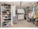 Spacious walk-in closet with custom shelving, drawers, and ample storage space at 2744 E Donato Dr, Gilbert, AZ 85298