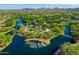 Aerial view of a community park featuring a splashpad, playground, and lakes surrounded by desert landscape at 2829 W Haley Dr, Anthem, AZ 85086