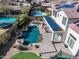 Aerial view of backyard featuring pool, patio, and lush landscaping, and solar panels at 2829 W Haley Dr, Anthem, AZ 85086