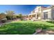 Large backyard with a pool, built-in BBQ, artificial turf, and a trampoline at 2829 W Haley Dr, Anthem, AZ 85086