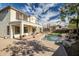 Expansive backyard with a covered patio, sparkling pool, and lush landscaping at 2829 W Haley Dr, Anthem, AZ 85086