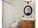 Cozy bathroom with a shower-tub combo, a white toilet, and a wooden vanity at 2829 W Haley Dr, Anthem, AZ 85086