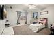 Spacious bedroom with carpet flooring, ceiling fan and two windows allowing plenty of natural light at 2829 W Haley Dr, Anthem, AZ 85086