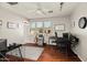Bedroom offering natural light, a ceiling fan, hardwood flooring, and bright white walls at 2829 W Haley Dr, Anthem, AZ 85086