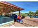 Community train station with a blue and red engine, covered platform, and picturesque views of a pond at 2829 W Haley Dr, Anthem, AZ 85086