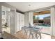 Bright dining area with a view of the pool, featuring tiled floors and sliding glass door at 2829 W Haley Dr, Anthem, AZ 85086