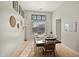 Bright dining room features stylish decor, a large table, and large windows providing ample natural light at 2829 W Haley Dr, Anthem, AZ 85086