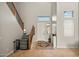 Bright entryway with tan tile flooring, tall ceilings, decorative rug, staircase and decorative railing at 2829 W Haley Dr, Anthem, AZ 85086