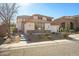 Exterior front view of a two story home with a three car garage, a tile roof, and neutral stucco at 2829 W Haley Dr, Anthem, AZ 85086
