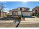 Charming two-story home with desert landscaping, a two-car garage, and a welcoming facade on a sunny day at 2829 W Haley Dr, Anthem, AZ 85086