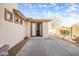 Exterior view of the home showcasing access to the backyard, concrete patio and neutral stucco at 2829 W Haley Dr, Anthem, AZ 85086