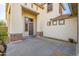 Front exterior of home showcasing the entryway, covered porch, and neutral stucco at 2829 W Haley Dr, Anthem, AZ 85086