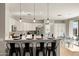 Open kitchen with granite countertops, stainless steel appliances, a breakfast bar, and tiled floors at 2829 W Haley Dr, Anthem, AZ 85086