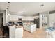 Open kitchen with granite countertops, stainless steel appliances, a center island, and tile flooring at 2829 W Haley Dr, Anthem, AZ 85086