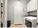 Laundry room features washer and dryer, tile flooring, and white cabinets at 2829 W Haley Dr, Anthem, AZ 85086