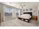 Spacious main bedroom with large windows, neutral tones, carpet, and a ceiling fan at 2829 W Haley Dr, Anthem, AZ 85086