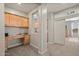 Well-lit office featuring built-in desk, cabinets, neutral paint, and carpeted floors at 2829 W Haley Dr, Anthem, AZ 85086
