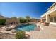 Sparkling pool with rock waterfall features, a spa, and beautiful patio area at 2829 W Haley Dr, Anthem, AZ 85086