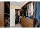 Spacious walk-in closet with custom shelving and ample storage for clothes and shoes at 2829 W Haley Dr, Anthem, AZ 85086
